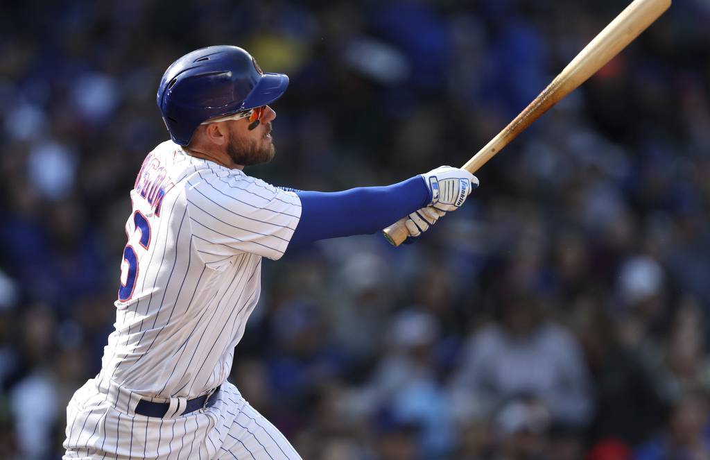 Cubs slugger Patrick Wisdom hits a solo home run in the fourth inning against the Rangers on April 8 at Wrigley Field. 