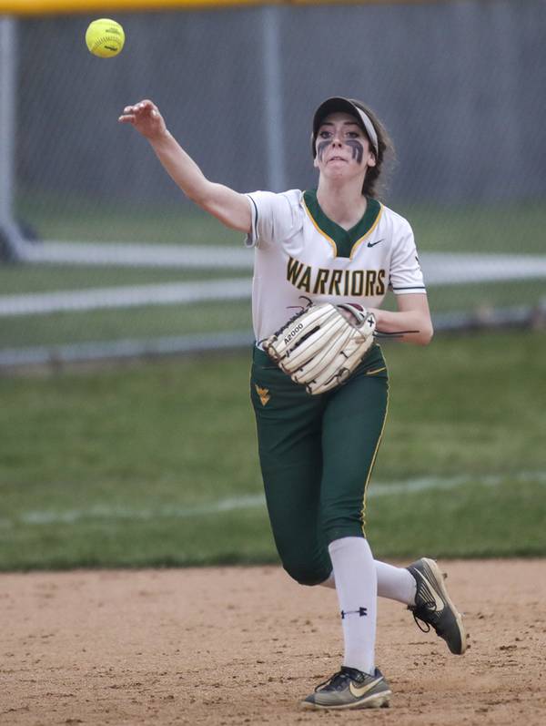 Waubonsie Valley’s Anna Riggs throws the ball to first base during a nonconference game against York in Aurora on Tuesday, April 12, 2022.