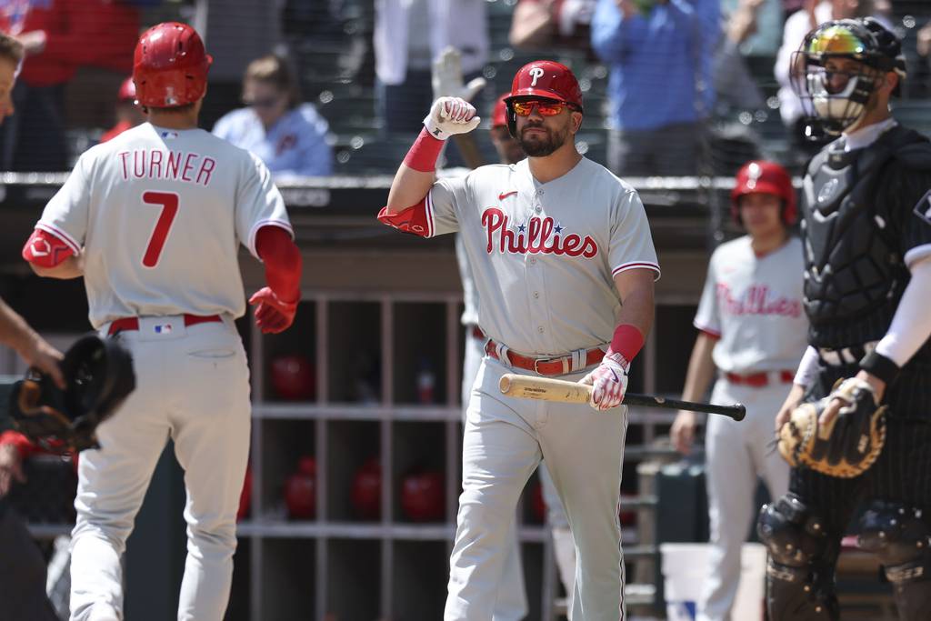 Phillies left fielder Kyle Schwarber (12) celebrates with shortstop Trea Turner (7) after Turner's home run in the first inning against the White Sox on Wednesday at Guaranteed Rate Field.