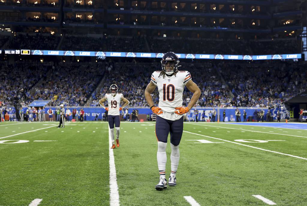 Bears wide receivers Chase Claypool (10) and Equanimeous St. Brown (19) head to the sideline after failing on third down in the fourth quarter against the Lions on Jan. 1, 2023, at Ford Field in Detroit.