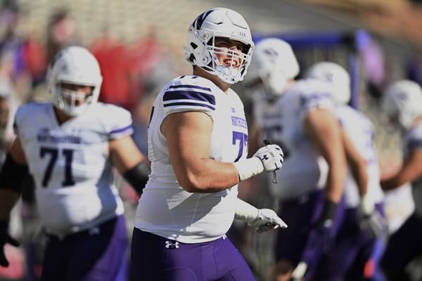 Northwestern offensive lineman Peter Skoronski warms up before a game against Maryland on Oct. 22, 2022, in College Park, Md.