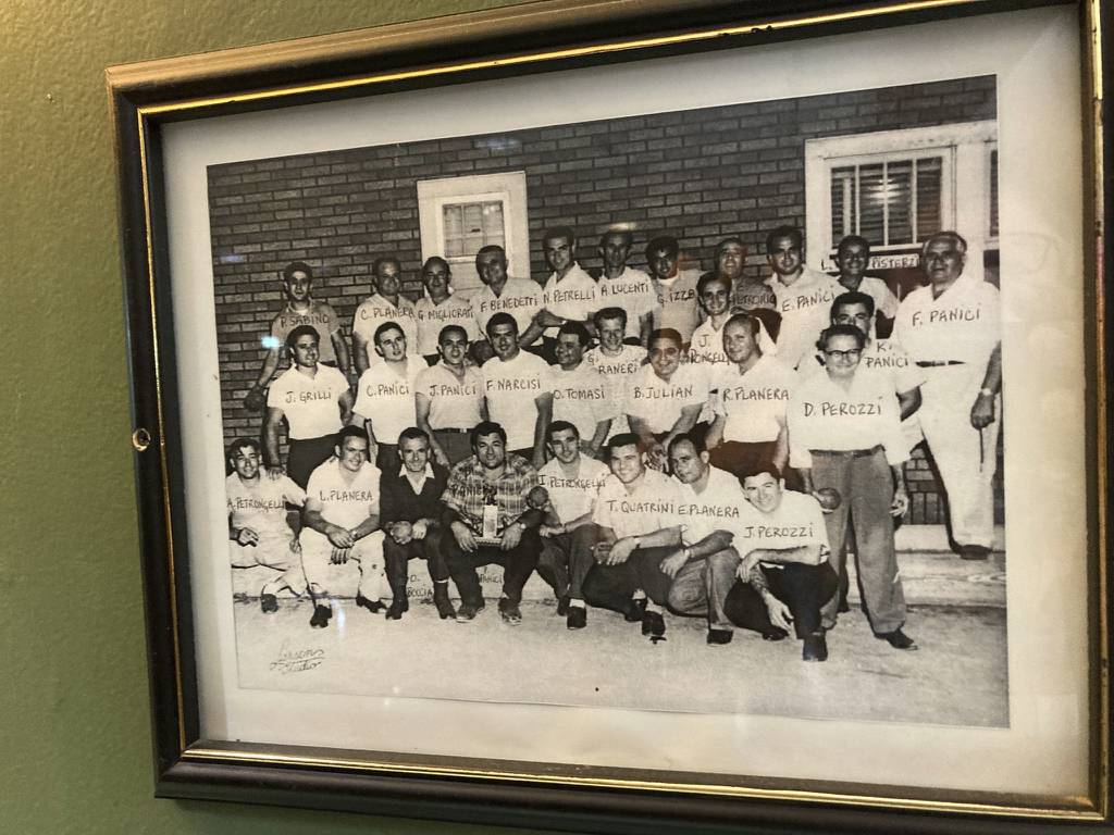An undated photograph of participants in a long ago bocce tournament hangs on the wall at 3 Star Tavern in Chicago Heights, which will close at the end of the month.
