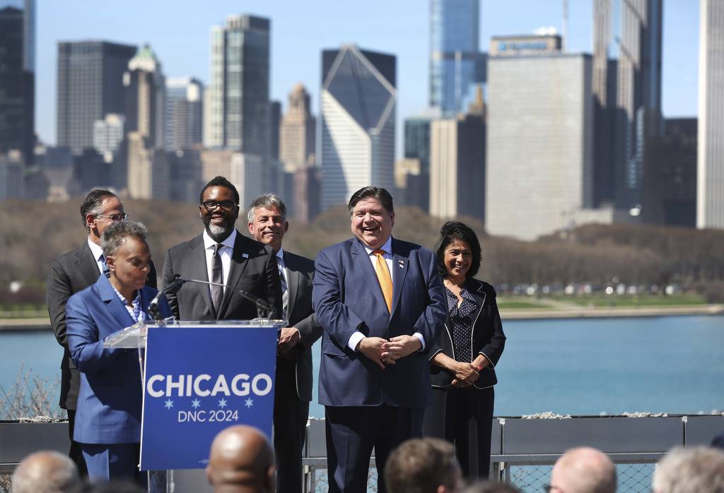 Chicago Mayor-Elect Brandon Johnson joins Illinois Gov. J.B. Pritzker Chicago Mayor Lori Lightfoot during a press conference to celebrate the selection of Chicago as the host for the 2024 Democratic National Convention on April 12, 2023.