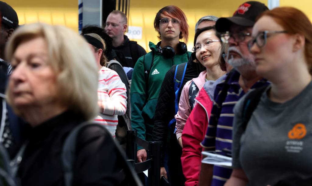 Travelers line up for security checks at Terminal 1 at O’Hare International Airport on May 18, 2023.