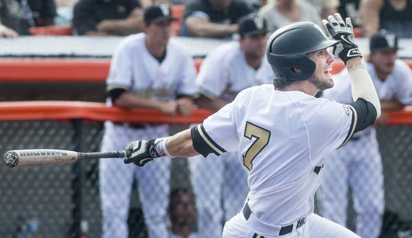 Vanderbilt's Dansby Swanson watches his hit during an NCAA Tournament super regional against Illinois on June 8, 2015, in Champaign. 