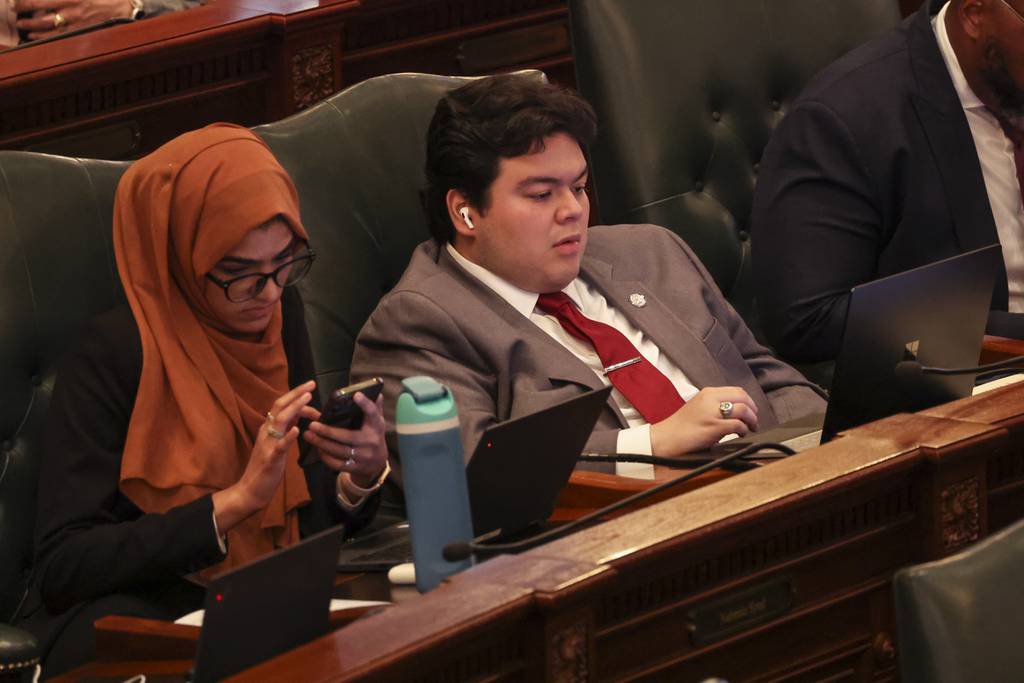 State Rep. Edgar Gonzalez Jr., right, during the legislative session at the Illinois State Capitol in Springfield on May 19, 2023. 