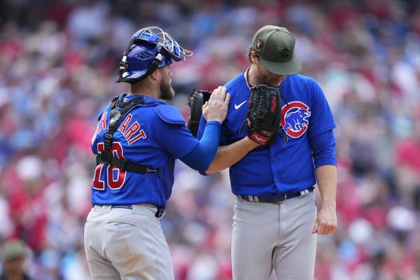 Cubs catcher Tucker Barnhart, left, meets with starting pitcher Justin Steele during the sixth inning against the Phillies on May 21, 2023.