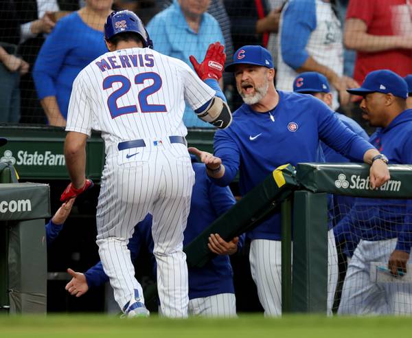 Cubs first baseman Matt Mervis (22) is congratulated by manager David Ross after Mervis hit a two-run home run in the second inning Tuesday, May 23, 2023, at Wrigley Field.