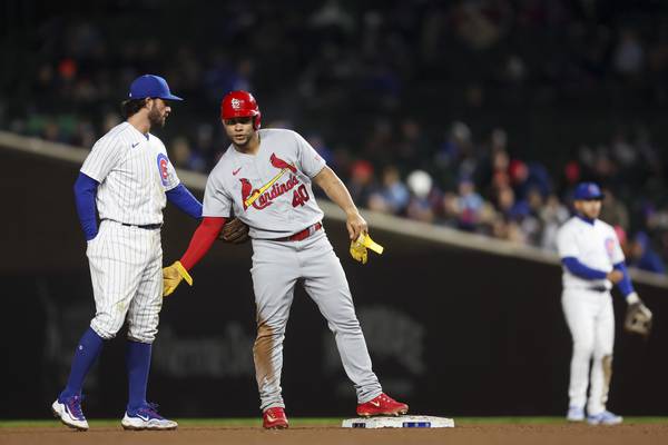 Cubs shortstop Dansby Swanson talks with Cardinals designated hitter Willson Contreras after Contreras hit an RBI double during the sixth inning Monday, May 8, 2023, at Wrigley Field.