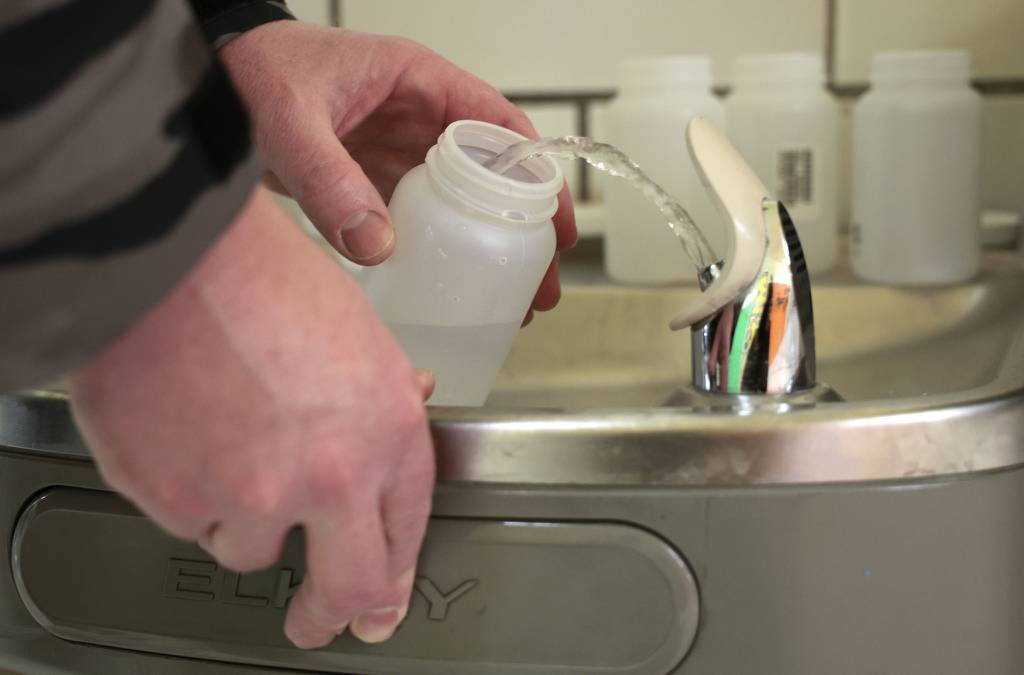 Water is collected for lead testing at a fountain at Newberry Math and Science Academy in Chicago in January.