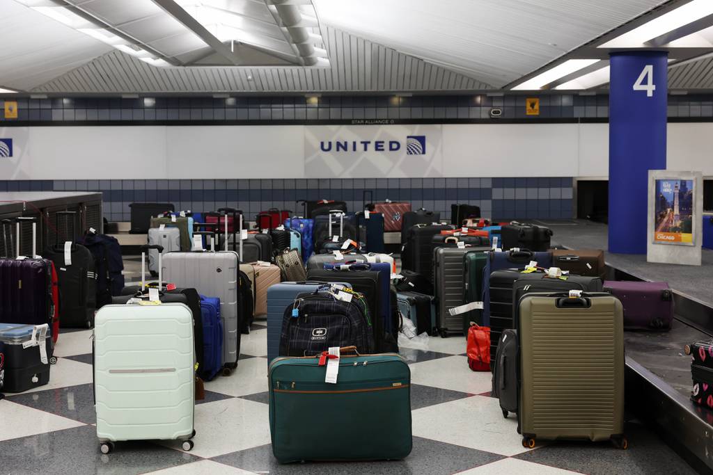 Unclaimed luggage fills the space between baggage claim carousels in Terminal 1 for United Airlines flights at O'Hare International Airport on June 29, 2023.