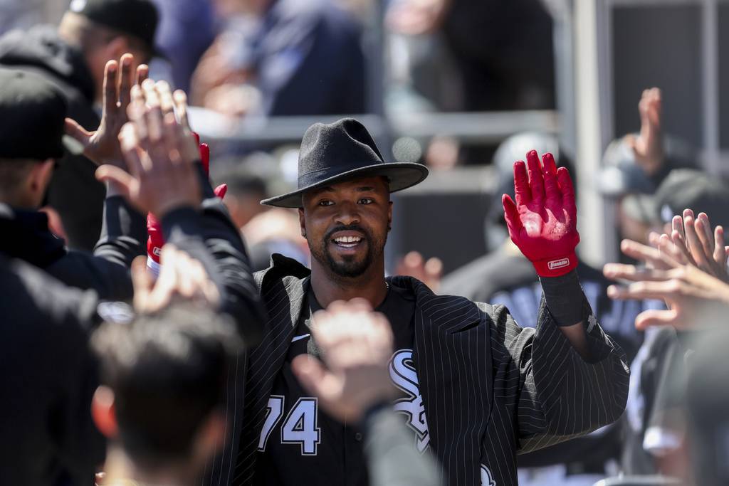 White Sox's Eloy Jiménez celebrates in the dugout after hitting a two-run homer during the third inning against the Twins at Guaranteed Rate Field on May 4, 2023.