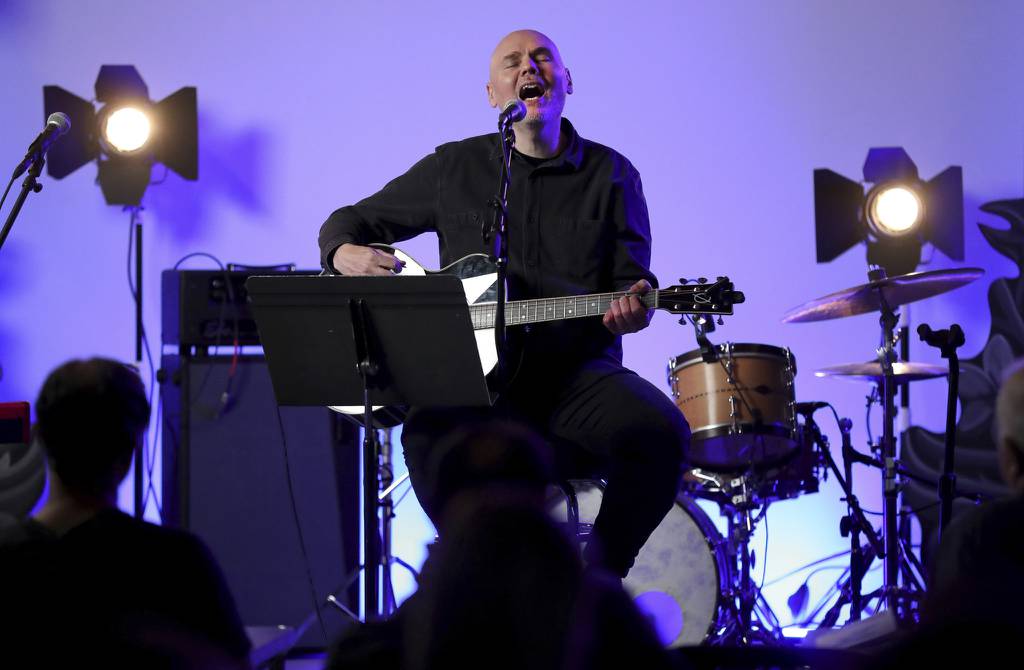 Musician Billy Corgan performs at his Madame Zuzu’s teashop in Highland Park on Wednesday, July 27, 2022, during a virtual concert to benefit the victims of the mass shooting that occurred during the 4th of July parade in the North suburb.  (Chris Sweda/Chicago Tribune)