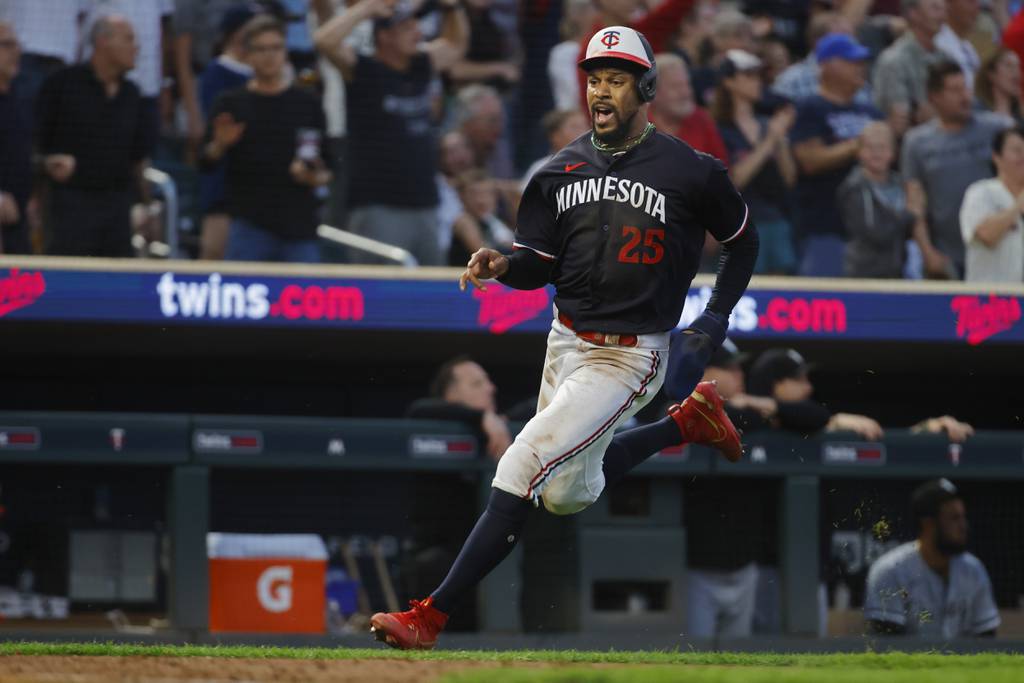 Twins designated hitter Byron Buxton scores on double by teammate Christian Vazquez against the White Sox in the seventh inning Saturday in Minneapolis.