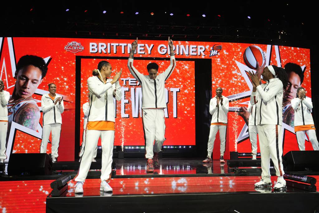 The Phoenix Mercury's Brittney Griner, of Team Stewart, center, reacts as she is introduced before the WNBA All-Star Game on Saturday in Las Vegas.