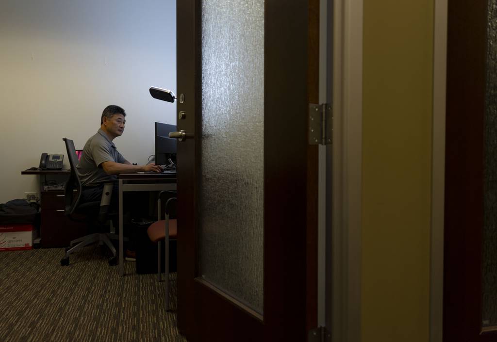 Tom Yuen works in a private office at a Regus co-working facility on June 15, 2023, in Lake Forest. 