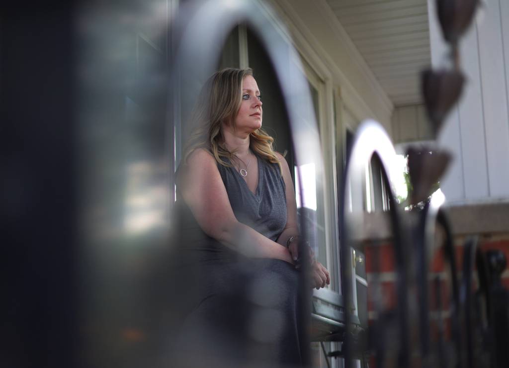 Jen Needham, who works in tourism and sales, sits outside her La Grange Park home on July 7, 2023. Needham finally received her passport four days before a work trip to Montreal.