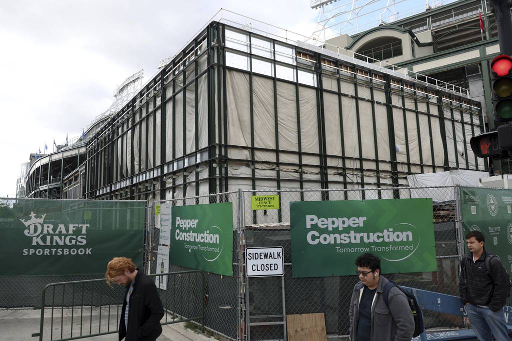 A DraftKings Sportsbook logo is posted on the construction fencing surrounding a future facility in the southeast corner of Wrigley Field Tuesday, Sept. 27, 2022, in Chicago. (John J. Kim/Chicago Tribune)