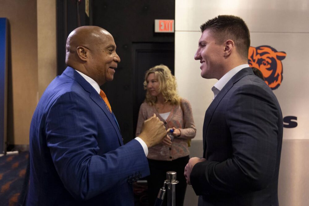Bears President and CEO Kevin Warren speaks to linebacker Jack Sanborn, rookie winner of the Brian Piccolo Award, on April 25, 2023, at Halas Hall.