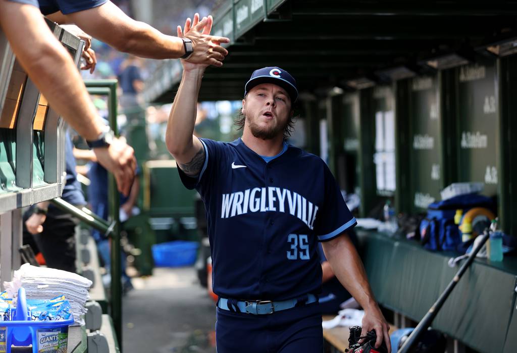 Cubs starting pitcher Justin Steele (35) is congratulated in the dugout after coming out of the game in the seventh inning against the Cardinals on Friday at Wrigley Field. He allowed two runs on six hits and struck out nine in 6 1/3 innings to improve to 10-3. 