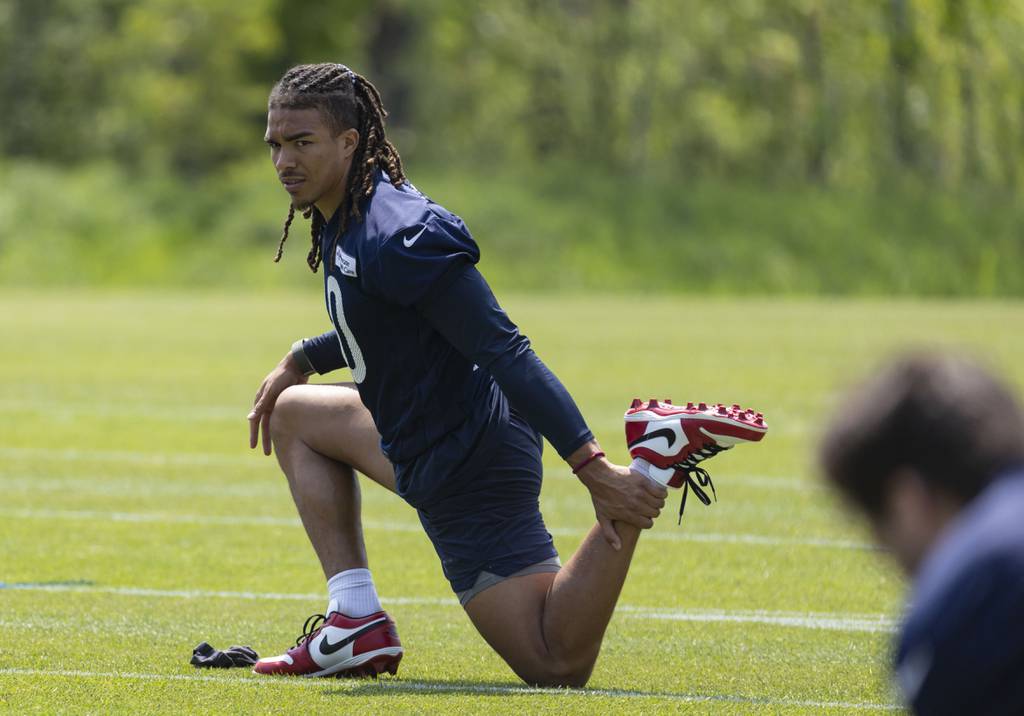 Bears wide receiver Chase Claypool stretches during organized team activities on May 23 at Halas Hall.