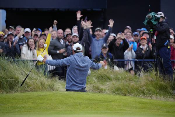 Scottie Scheffler reacts to the crowd after a bunker shot on the 18th hole during the second round of the British Open at Royal Liverpool on Friday, July 21, 2023, in Hoylake, England.