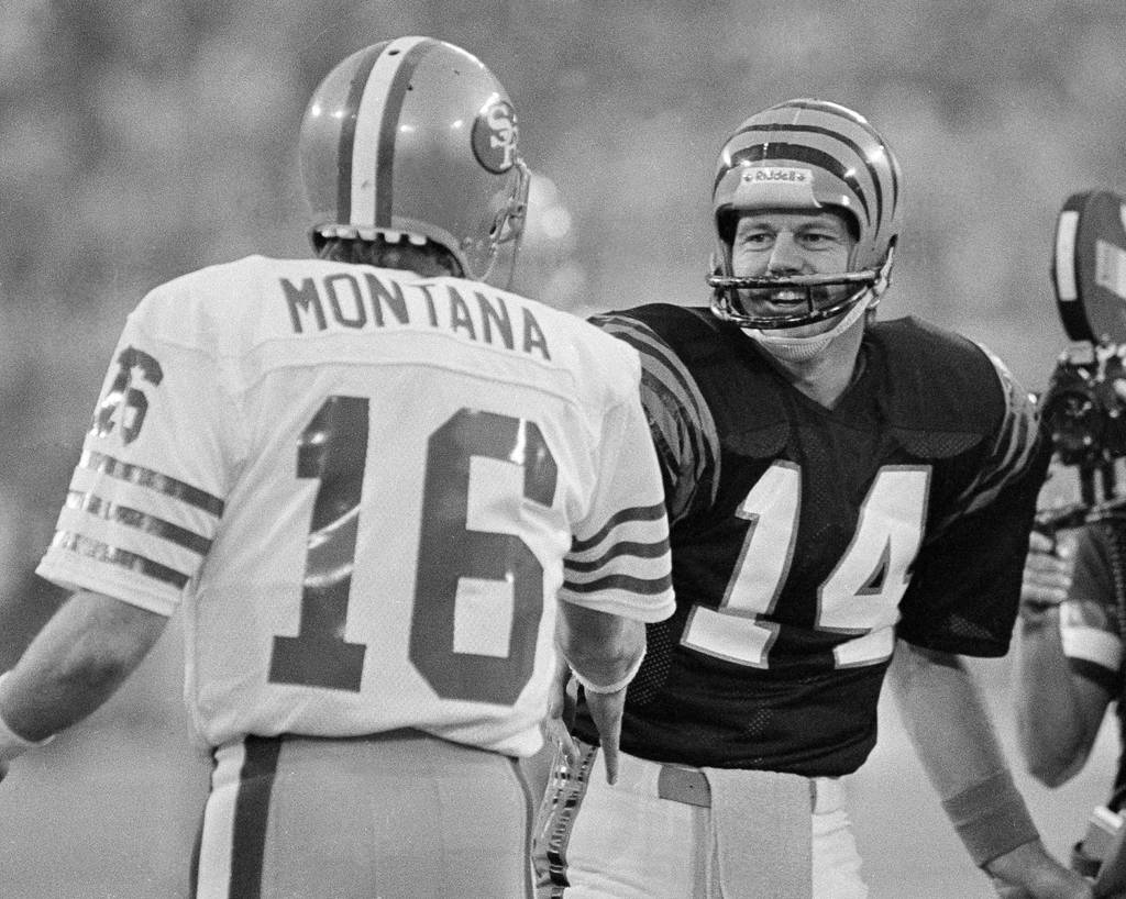 Cincinnati quarterback Ken Anderson (14) greets San Francisco's Joe Montana (16) before the pre-game coin flip for the 1981 Super Bowl played at the Pontiac Silverdome on Sunday, Jan. 24, 1982.