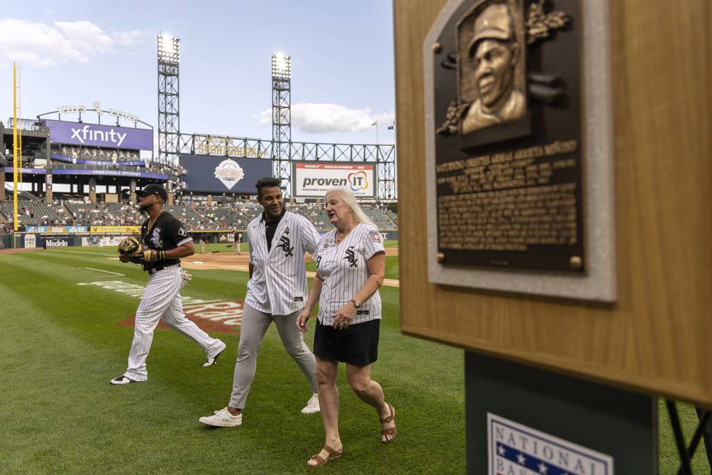 Sharon Rice-Miñoso and her son Charlie Rice-Miñoso attend a ceremony on July 30, 2022, at Guaranteed Rate Field honoring the late Minnie Miñoso's posthumous induction into the Baseball Hall of Fame six days earlier.