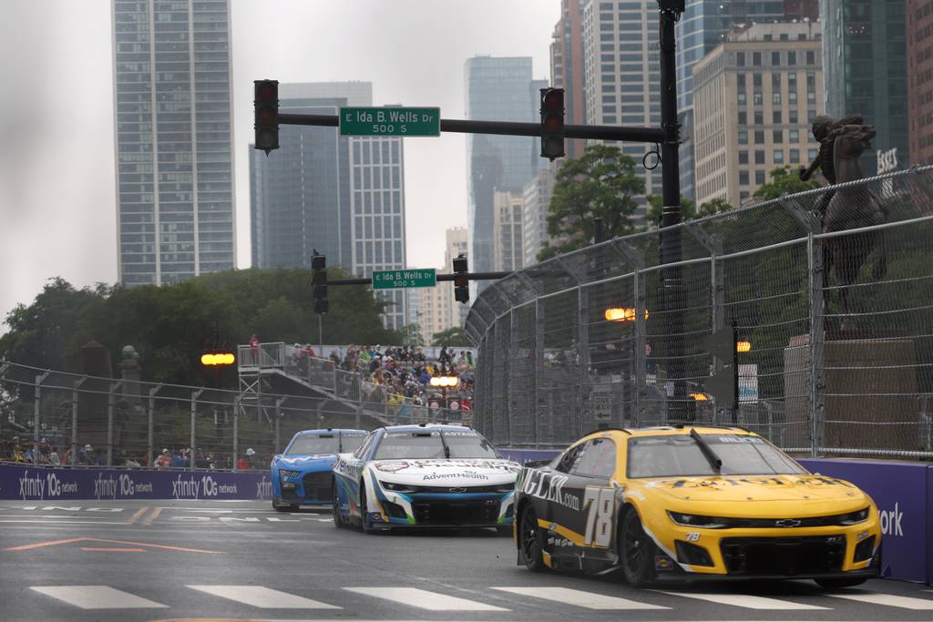 Josh Bilicki's No. 78 car and other cars race on Congress Plaza during Stage 1 of the NASCAR Cup Series race at Grant Park on Sunday, July 2, 2023.