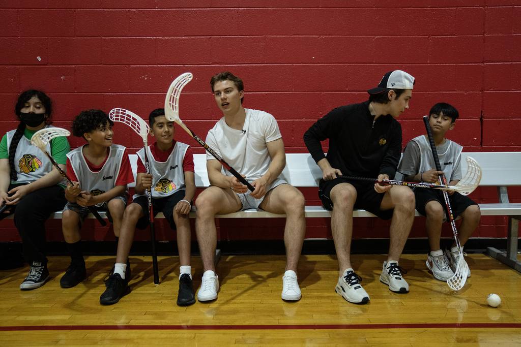 Blackhawks draft picks Connor Bedard, center left, and Martin Misiak, center right, play floor hockey with kids from the James R. Jordan Boys and Girls Club on the Near West Side on Wednesday, July 5, 2023.
