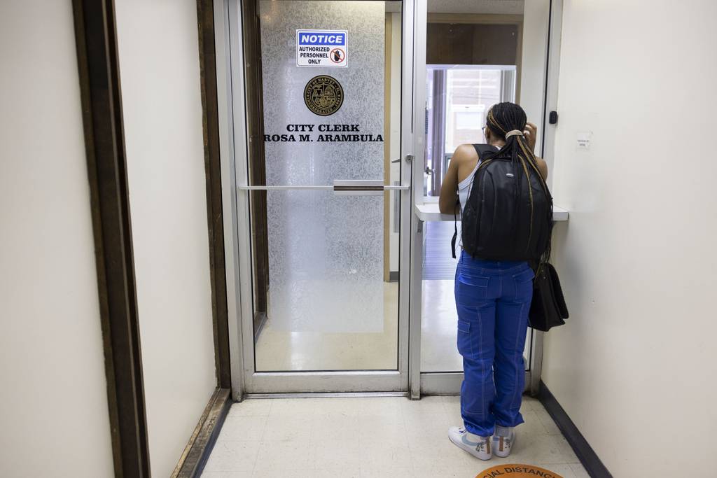 Amethyst Davis waits to get video recordings of City Council meetings at Harvey City Hall on July 6, 2023.