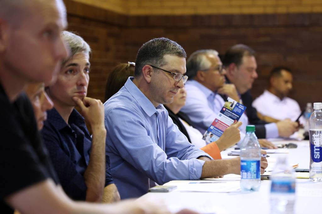 32nd Ward committeeperson Ald. Scott Waguespack, center, prepares to conduct in-person interviews at the Hamlin Park field house in Chicago on Monday, July 10, 2023, to fill the vacancy created by the resignation of Sen. Cristina Pacione-Zayas.