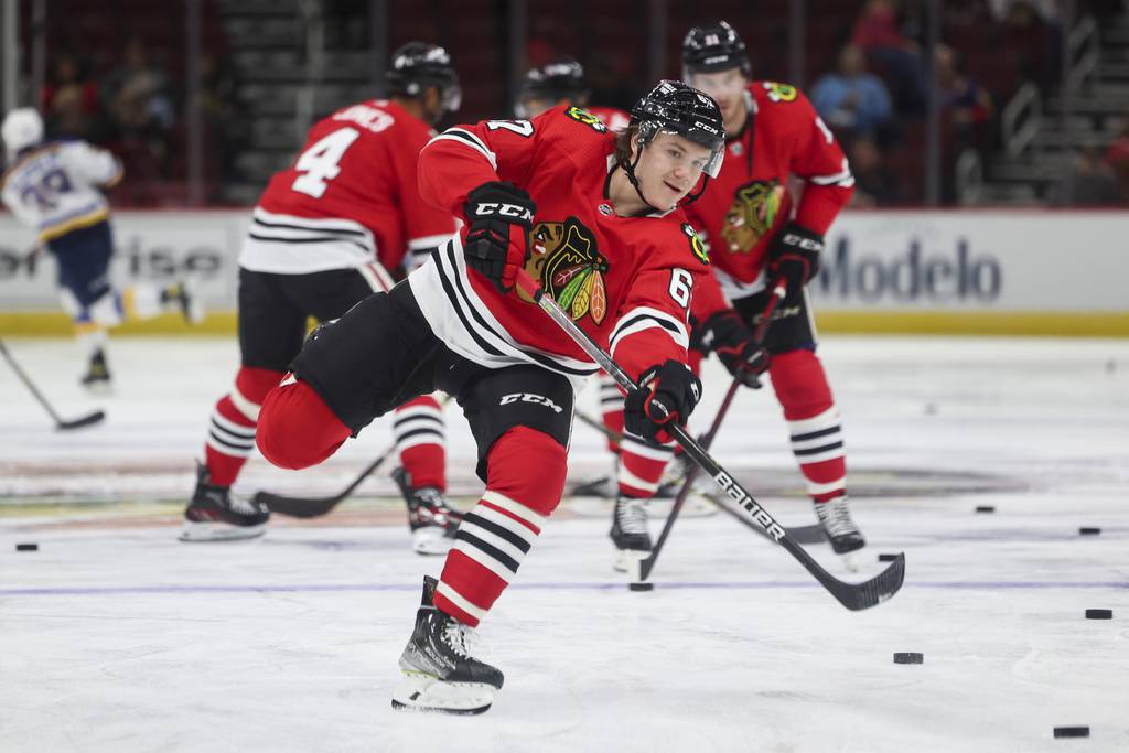 Blackhawks left wing Sam Savoie warms up before the first period against the Blues at the United Center on Sept. 27, 2022.