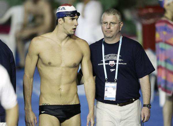 U.S. swimming star Michael Phelps, left, walks with his coach Bob Bowman during a training session at the World Swimming Championships in Melbourne, Australia in this undated file photo.