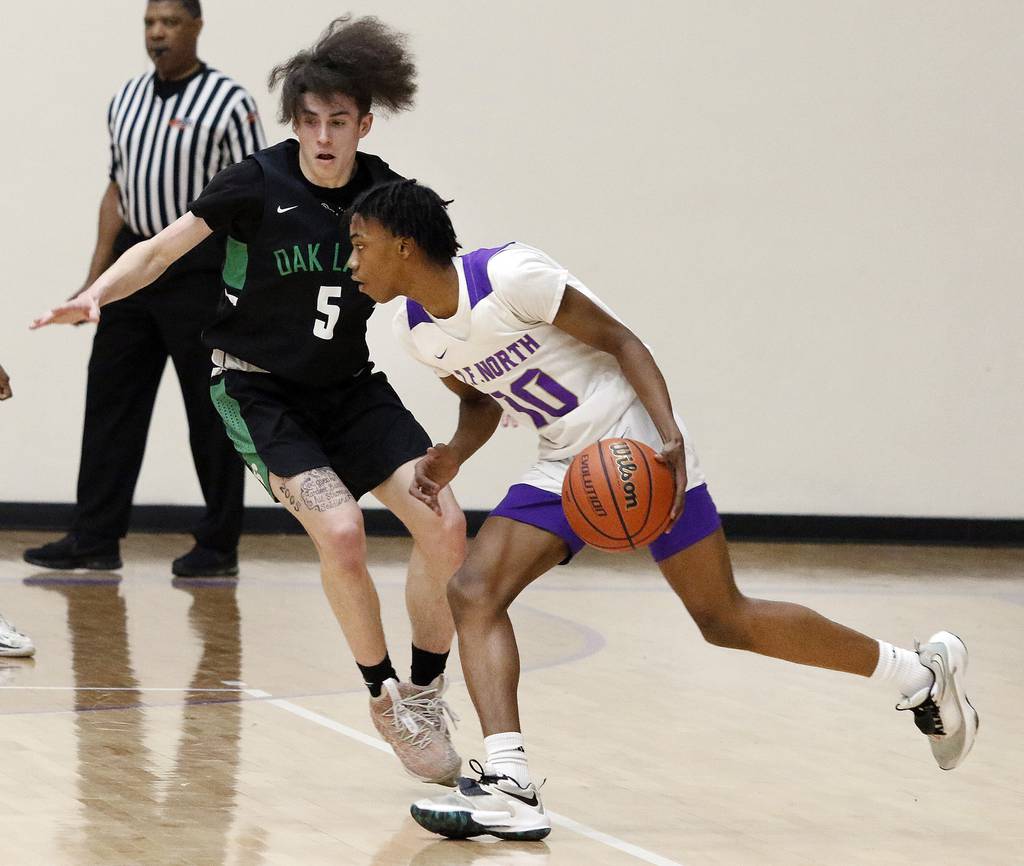 T.F. North's Chase Abraham (10) drives around Oak Lawn's Robert Wagner (5) during a South Suburban Conference crossover in Calumet City on Thursday, Jan. 26, 2023.