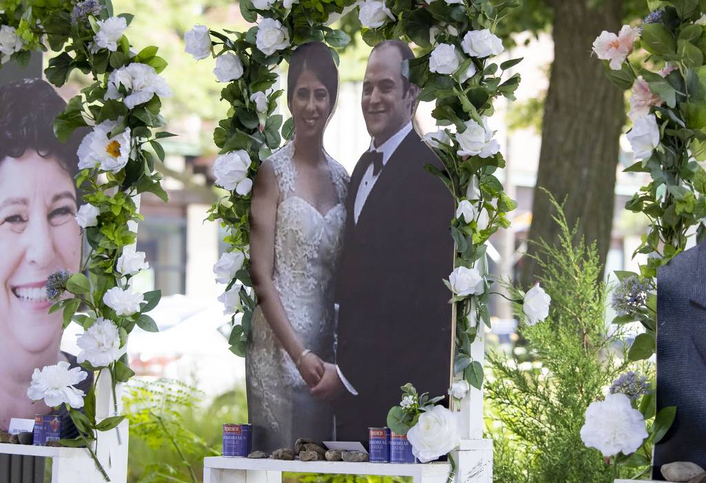 Irina and Kevin McCarthy are depicted along with the other five victims at a memorial near the Central Avenue site, July 7, 2022, three days after the mass shooting at the Fourth of July parade in Highland Park.