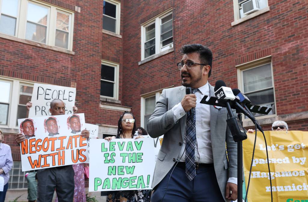 Ald. Byron Sigcho-Lopez, 25th, addresses residents and housing advocates during a rally and protest in the courtyard of an apartment building in the 10300 block of South Walden Parkway on July 19, 2023, in Chicago.