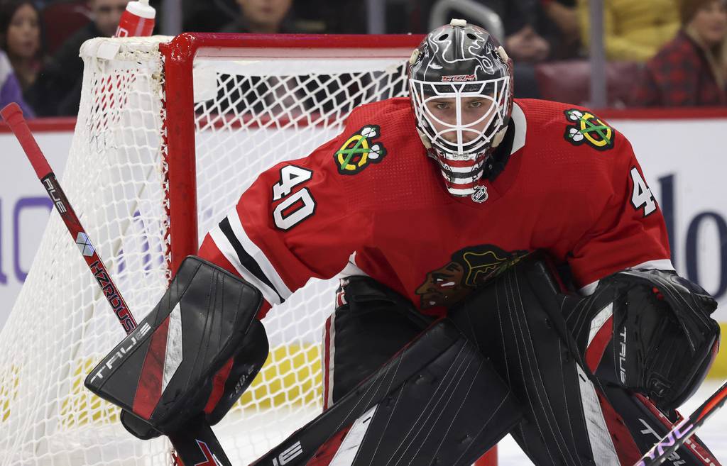 Blackhawks goaltender Arvid Söderblom keeps his eyes on the puck on Dec. 9, 2022, at the United Center.