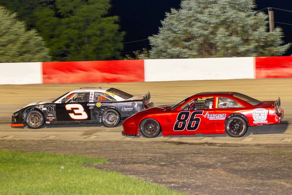 Rickey Mathis Jr. (3) battles with second-place James Dean during the Jake Bradley Memorial race at Grundy County Speedway on Friday, July 7, 2023.