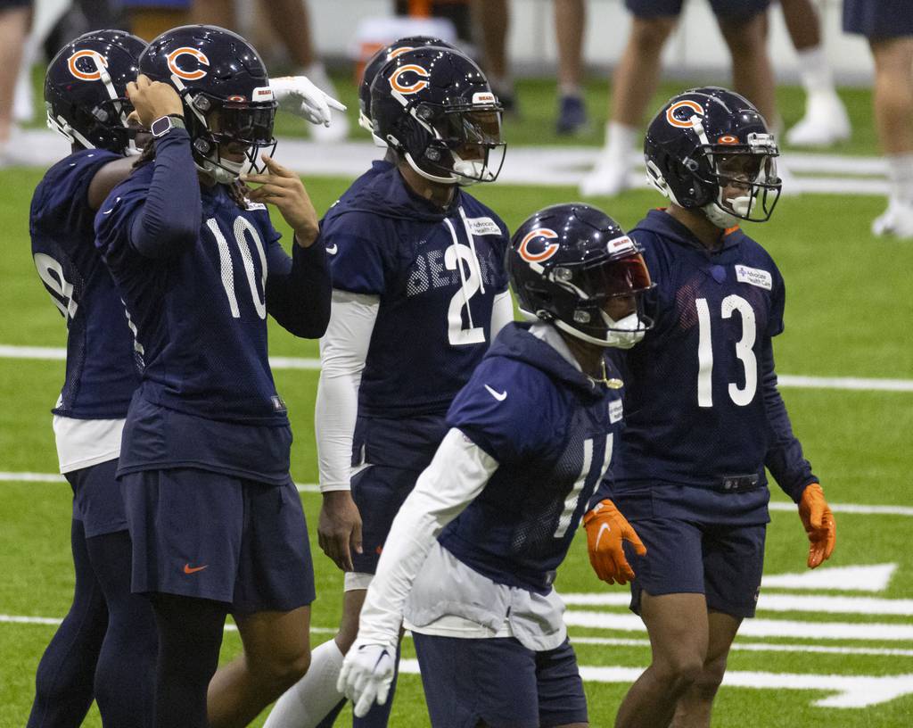 Bears wide receivers Chase Claypool (10), DJ Moore (2), Darnell Mooney (11) and Tyler Scott practice Wednesday during training camp in the Walter Payton Center at Halas Hall.