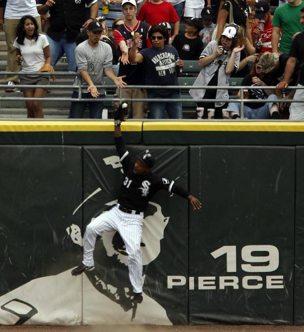 White Sox CF Dewayne Wise goes up to catch a ball hit by the Rays' Gabe Kapler in the ninth inning of Mark Buehrle's perfect game.