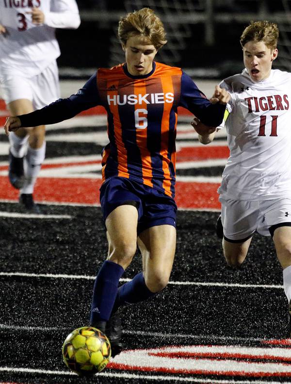 Naperville North’s Cameron Radeke, left, keeps Plainfield North’s Noah Horner away from the ball during the Class 3A Bolingbrook Regional championship game on Friday, Oct. 22, 2021.