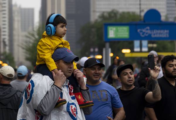Fans along South Michigan Avenue try to catch a glimpse of the action as the NASCAR Cup Series race gets underway on July 2, 2023.