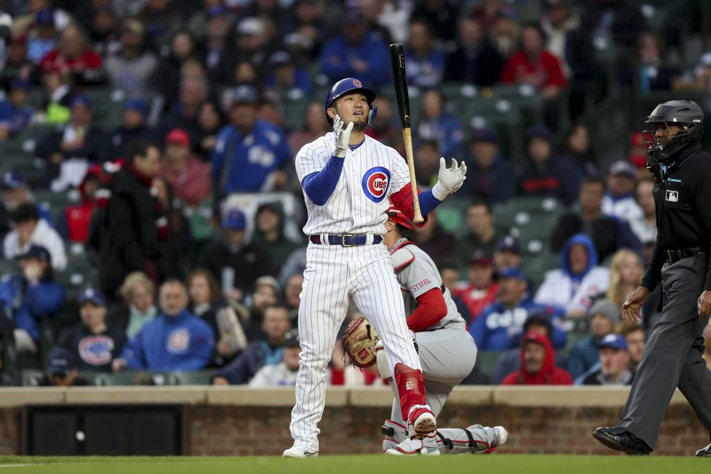 Cubs right fielder Seiya Suzuki grabs his bat after striking out during the first inning against the Cardinals on May 8 at Wrigley Field.