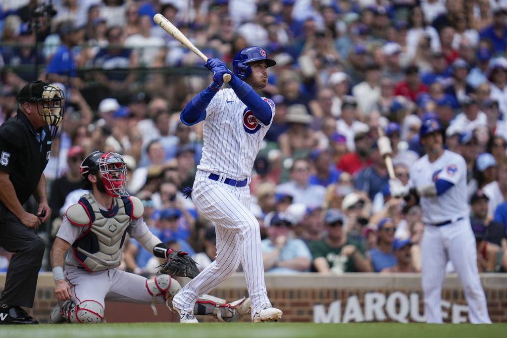 Cubs center fielder Cody Bellinger hits a grand slam during the third inning against the Red Sox on Saturday at Wrigley Field.