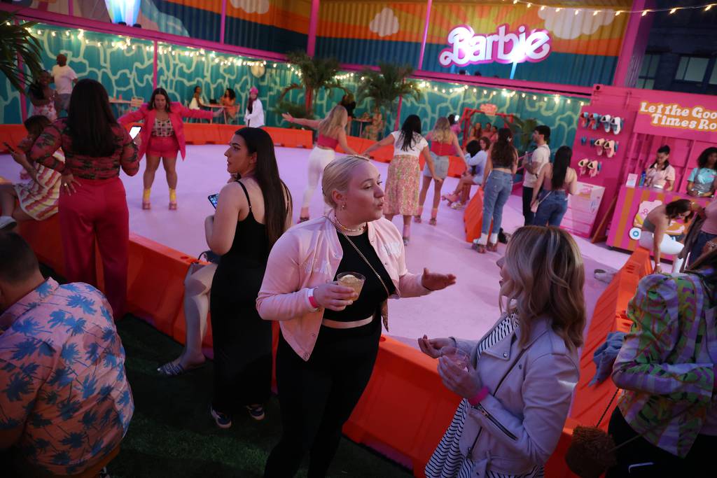 People gather at the Malibu Barbie Cafe, a pop-up restaurant with a roller rink, on South Racine Avenue in Chicago on June 5, 2023. 