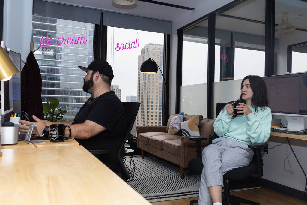 Mike Weiss, left, and Victoria Roedel of Ice Cream Social ad agency work in their private office in the WeWork location at 330 N. Wabash Ave. in Chicago on June 16, 2023. 