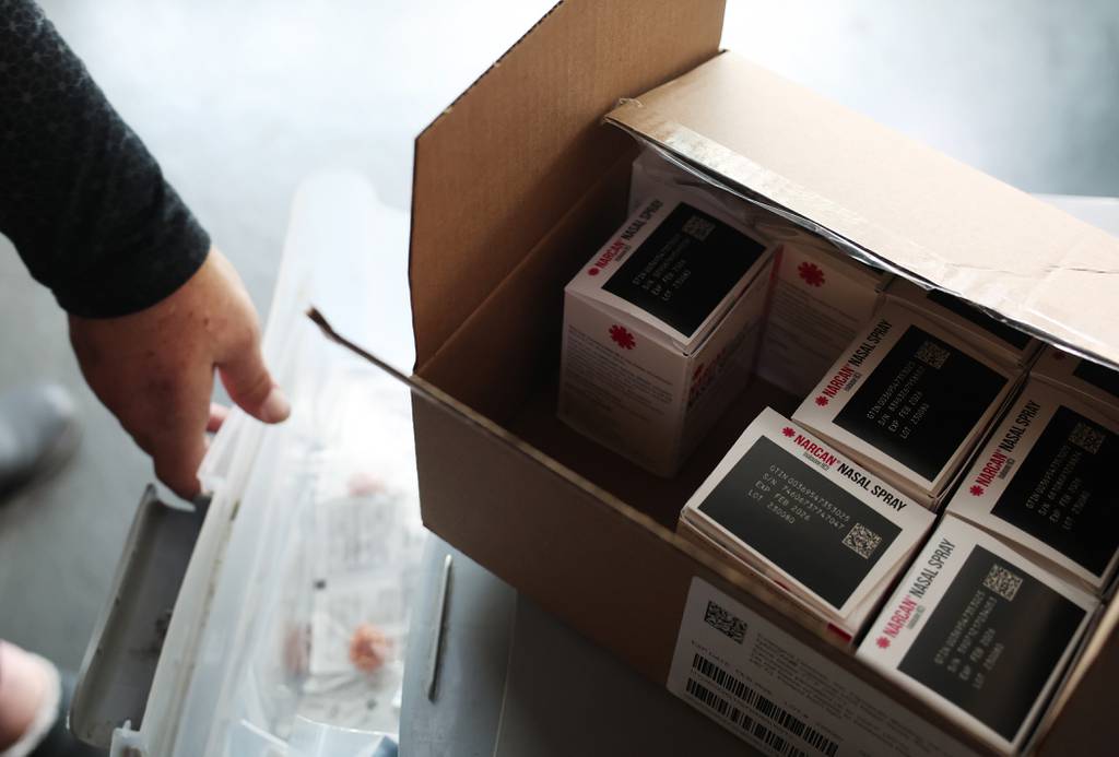 A box of Narcan nasal spray atop a cabinet as Karen Bigg, a harm reductionist for the Chicago Recovery Alliance, gathers items for drug users at Humboldt Park on July 25, 2023, in Chicago. 