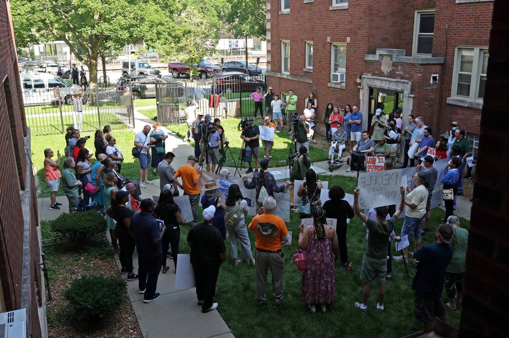 Residents and housing advocates gather for a rally and protest in the courtyard of an apartment building in the 10300 block of South Walden Parkway on July 19, 2023, in Chicago.
