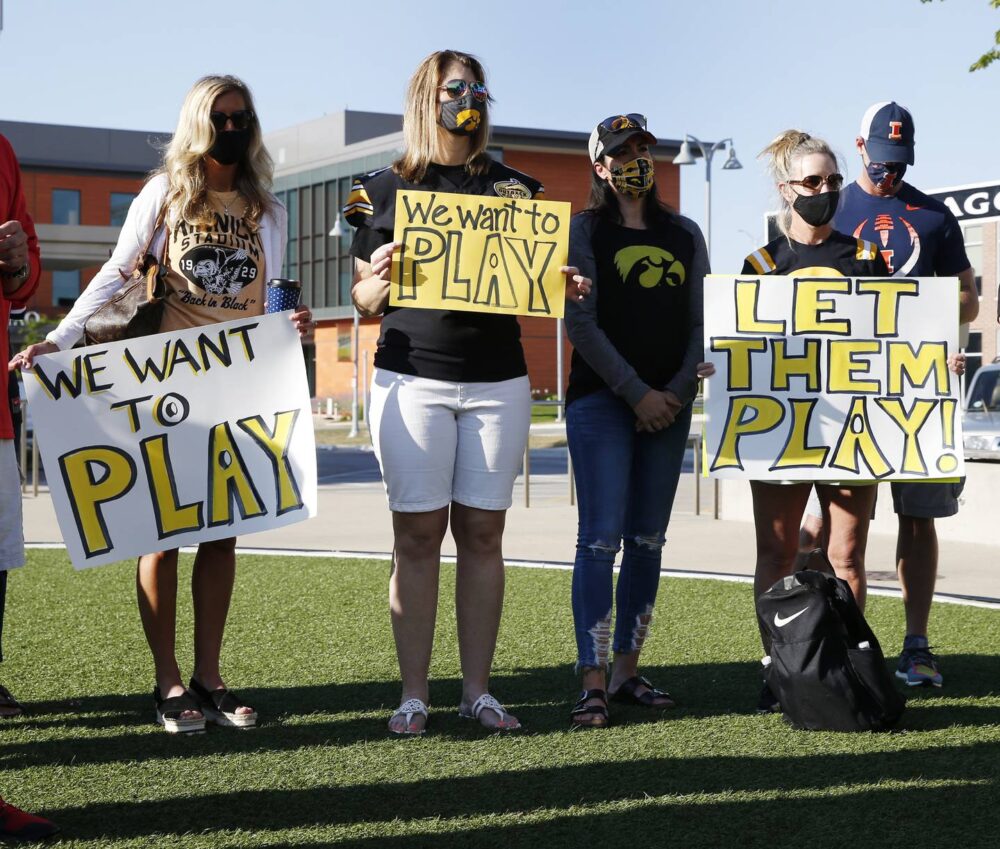 Parents of University of Iowa football players protest the postponement of the Big Ten season outside conference headquarters in Rosemont on Aug. 21, 2020.